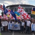 О чём говорят украинские и грузинские флаги на митинге в РФ